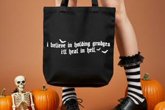 Sarcastic Halloween digital design featuring a gothic grudges quote in distressed black lettering with flying bats.