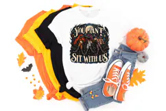 Witch coven digital PNG featuring “You Can’t Sit With Us” in large vintage-style lettering with three seated witches, textured clothing, celestial details and dark woodland accents.