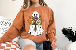 Spooky cute ghost illustration holding colorful flowers with skull accents. Perfect blend of Halloween charm and floral aesthetic.