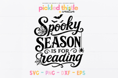 Black and white spooky season SVG with reading-themed text, decorative script, bats, spider webs, and a playful Halloween layout.