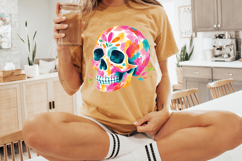 Digital PNG featuring one complete colorful skull design with bold brush strokes, teal eye sockets, white teeth, and playful painted details.