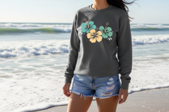 Cluster of three tropical hibiscus flowers with rounded petals and stylized centers, featuring subtle texture and soft color contrast on a neutral background.