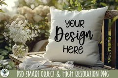 Mockup image of a white pillow sitting on a porch with white flowers