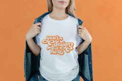 White t-shirt woman model mockup on orange background Product Image 1