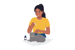 Woman Giving Eye Drops to Gray Cat in Yellow Shirt Indoor Pe Product Image 1