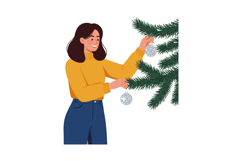 Woman decorating Christmas tree with silver baubles in winte Product Image 1