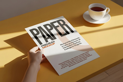 A4 Papern Mockup Hand Holding Cup Coffee Scene Product Image 1