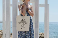 tote-bag-mockup-featuring-a-woman-by-the-sea-with summer print design