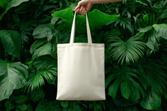 Hand Holding Canvas Tote Bag Mockup Product Image 1