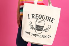 Tote bag with I require coffee not your opinion design printed on it.