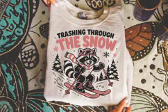 Trashing through the snow PNG, Funny raccoon t-shirt graphic Product Image 3