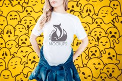 Halloween White t-shirt model mockup on orange ghosts BG Product Image 1