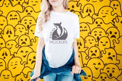 Halloween White t-shirt model mockup on orange ghosts BG Product Image 1