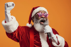 Santa Claus, raising arms joyfully against an orange Product Image 1