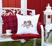 Love embroidery design shown on cushion
