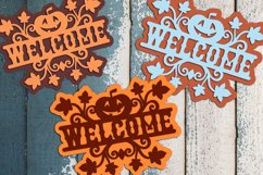 various colored pumpkin welcome signs