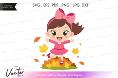 Happy girl playing in fall leaves Product Image 1