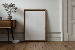 Blank poster frame mockup on white wall living room Product Image 1