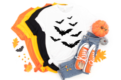 Spooky flying bat PNG design with grunge texture and bold black shapes on a clean white background.