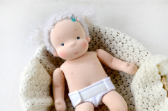 Diaper for 14-15 inch (36-38 cm) Waldorf baby doll, including printable PDF sewing pattern and step-by-step tutorial for creating handmade doll clothes and accessories, perfect for DIY projects.