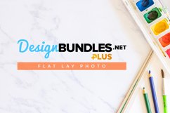 flat lay photo of watercolor paint, color pencil, paint brush and sketch pad