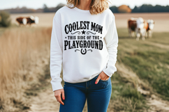 Western mama cut file with vintage distressed black typography arranged in an arched layout with rustic cowboy details for t-shirts, tote bags, and decals.