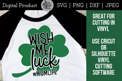 Wish Me Luck Momlife St Patricks Day Mom quote design shown on a white and black baseball T shirt