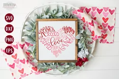Valentine's Words in the shape of a heart shown on a white sign with wooden frame