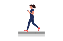 Woman walking while looking at smartphone in casual outfit v Product Image 1