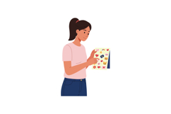 Young woman examining colorful sticker sheet with hearts and Product Image 1