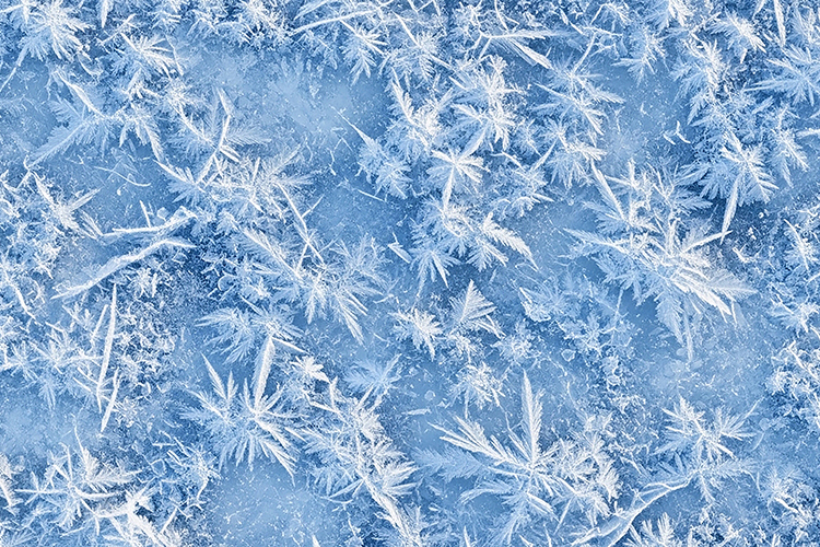 Frost patterns on a blue background