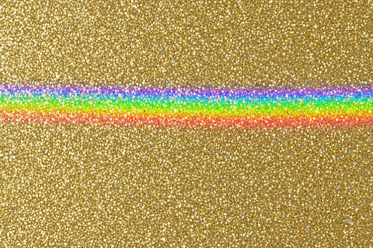 Rainbow stripe on a glittery gold background with sparkling
