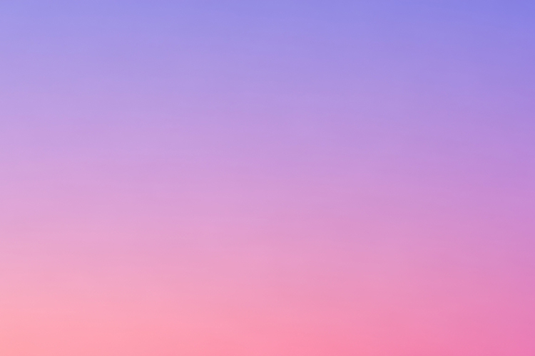 Gradient sky transitioning from purple to pink during sunset