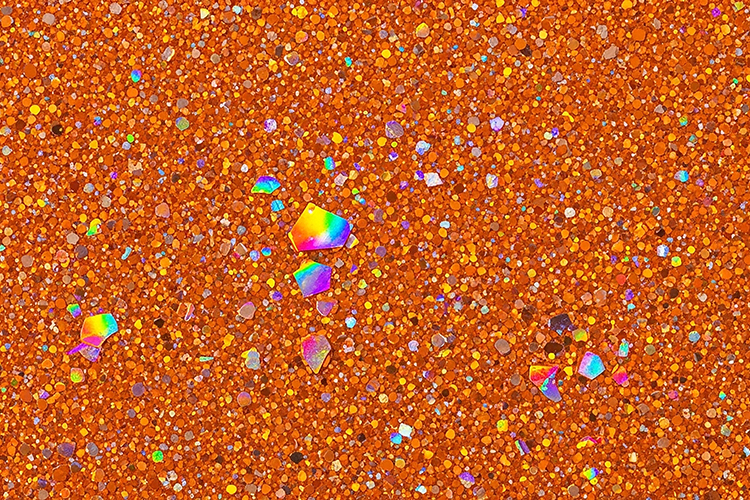 Orange glitter background with holographic sparkles