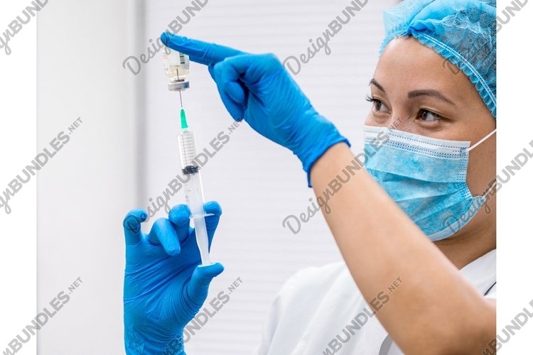 Doctor prepares a syringe with an injection, close-up example image 1
