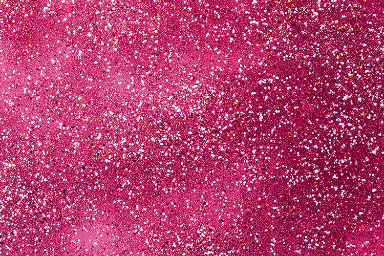 Pink glitter background with sparkling white specks