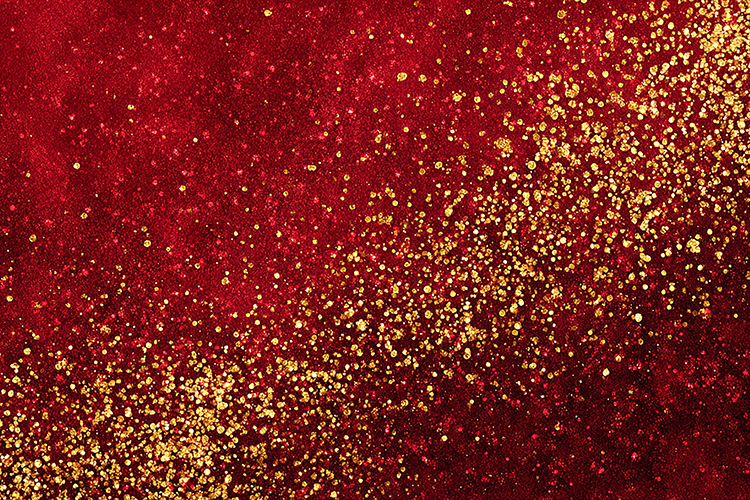 A vibrant red background with gold glitter sparkles