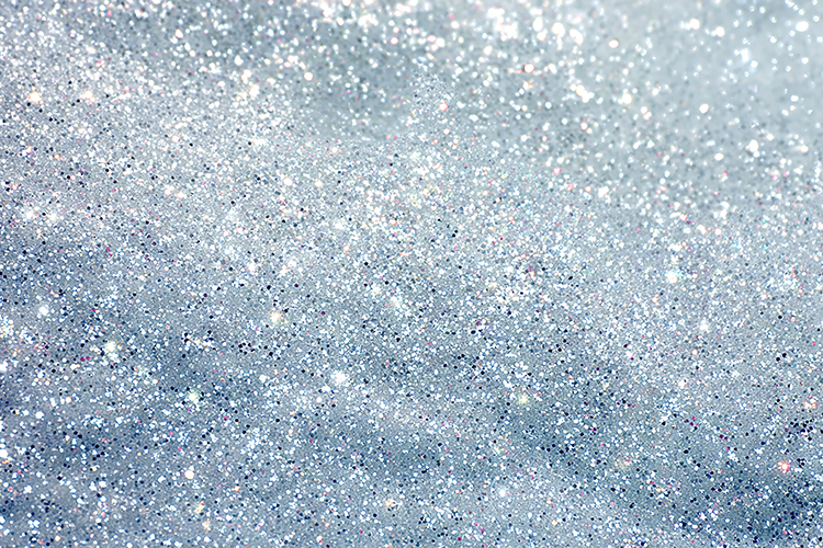 A sparkling silver glitter background and shimmering effect