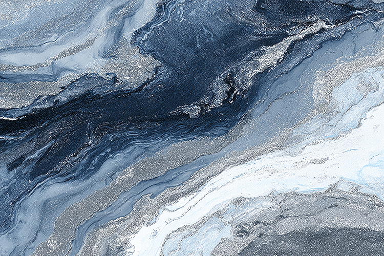 A marble surface swirling patterns of blue, gray, and white