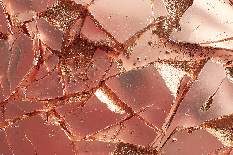 Shattered pink glass with sharp edges   reflective surfaces