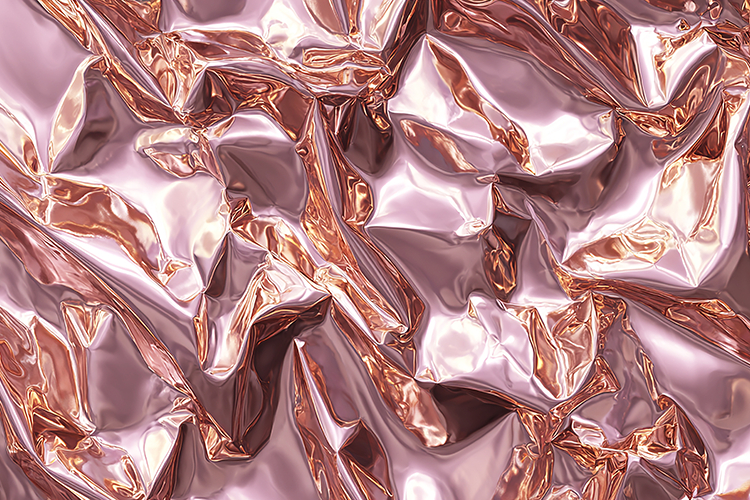A crumpled metallic foil with a rose gold
