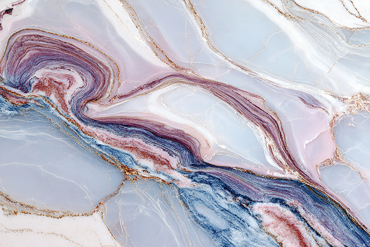 A marble pattern with swirling colors and gold accents