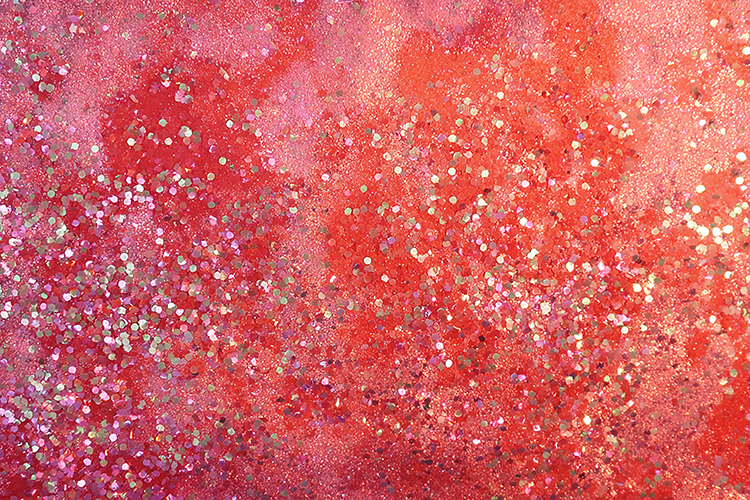 Red background with glitter and sparkles