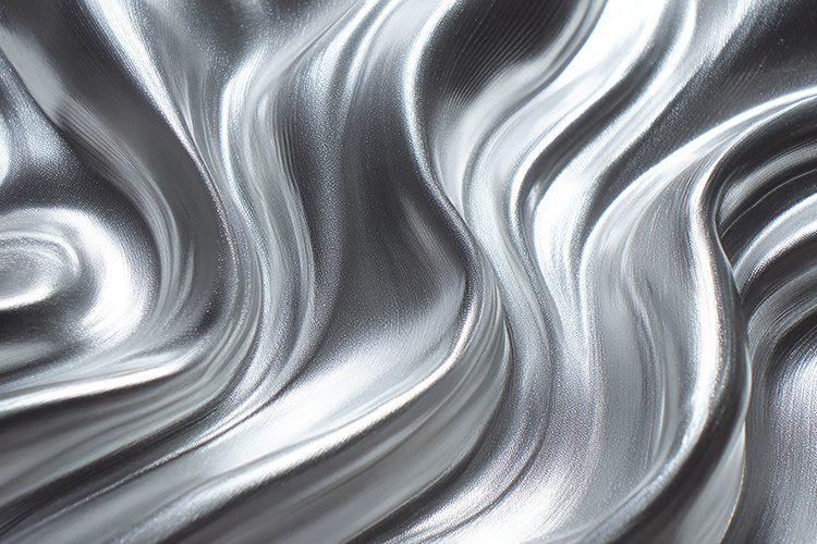 A shiny silver fabric with wavy folds