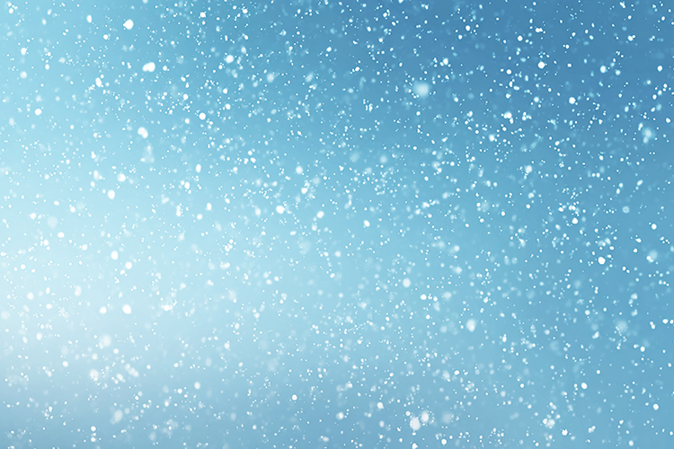 A serene blue background with snowflakes gently falling