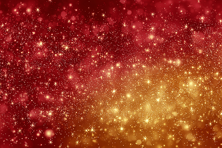 A vibrant red and gold starry night sky with sparkling light