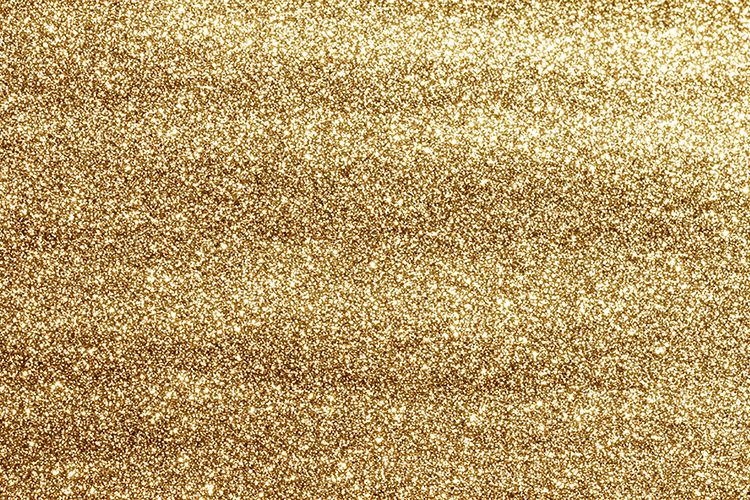 A gold glitter background with a shiny texture