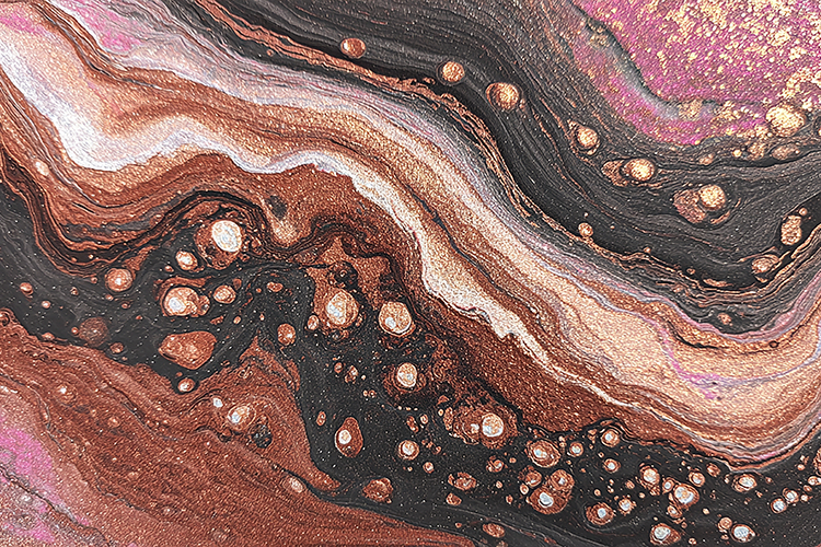 Swirling patterns of pink, gold, and black hues and texture