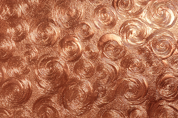 Copper surface with a swirling pattern