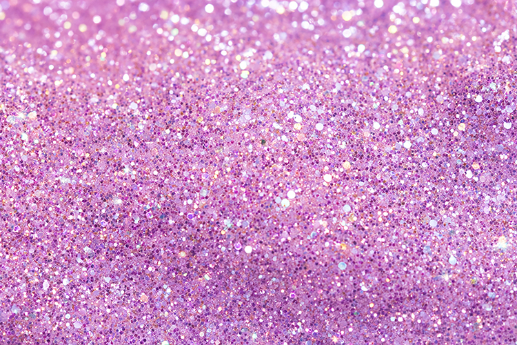 Purple glitter background with sparkling particles